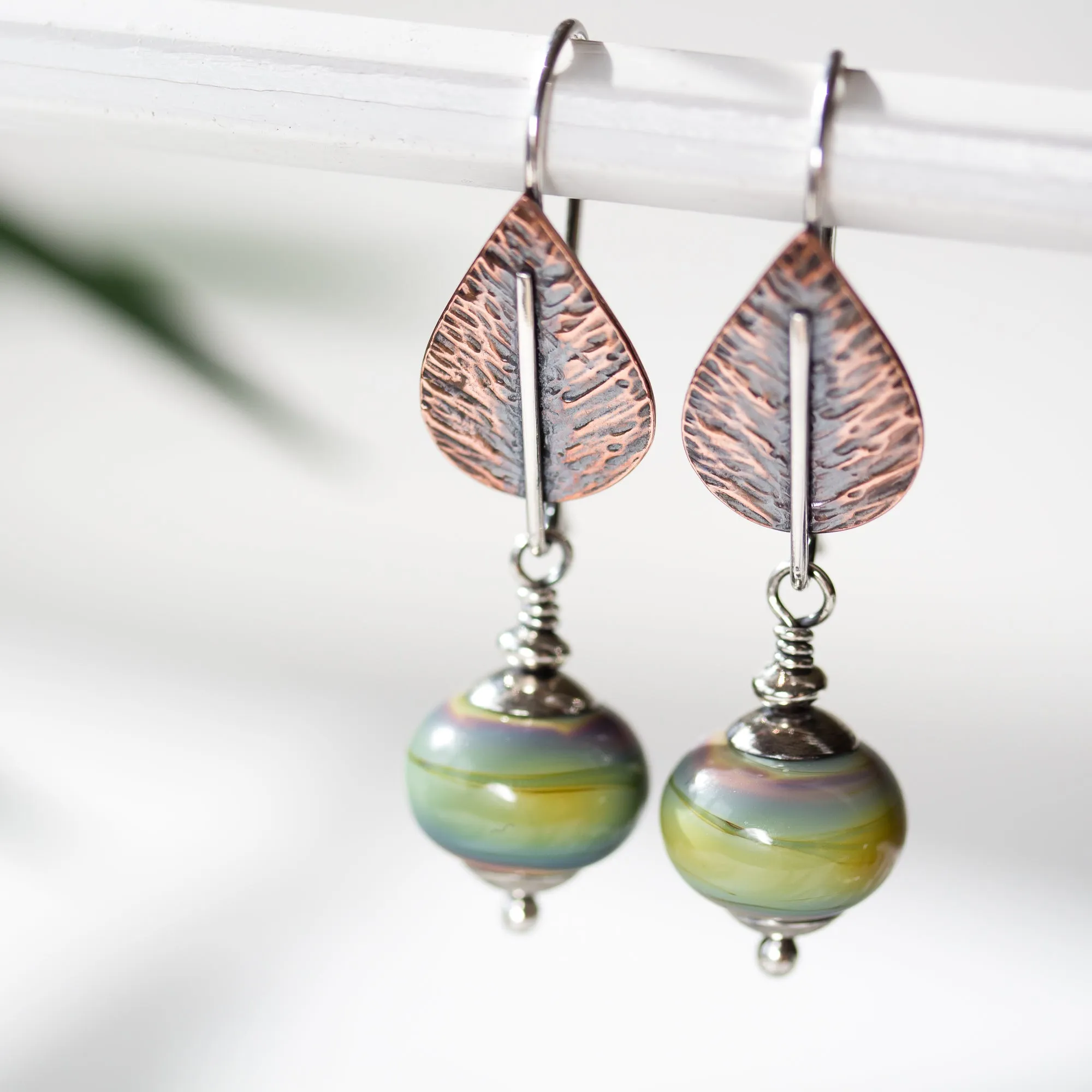 Pastel Green Earrings, hammered copper leaf with lampwork beads